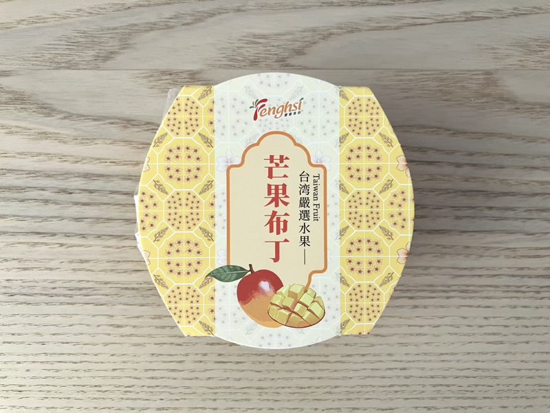 黄色の小花柄とマンゴーのイラストが描かれたパッケージ上面